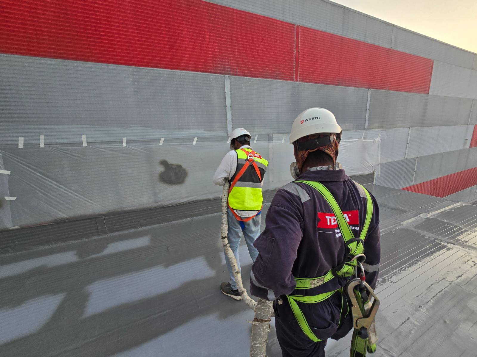 Hot spray polyurea waterproofing applied to a reservoir structure